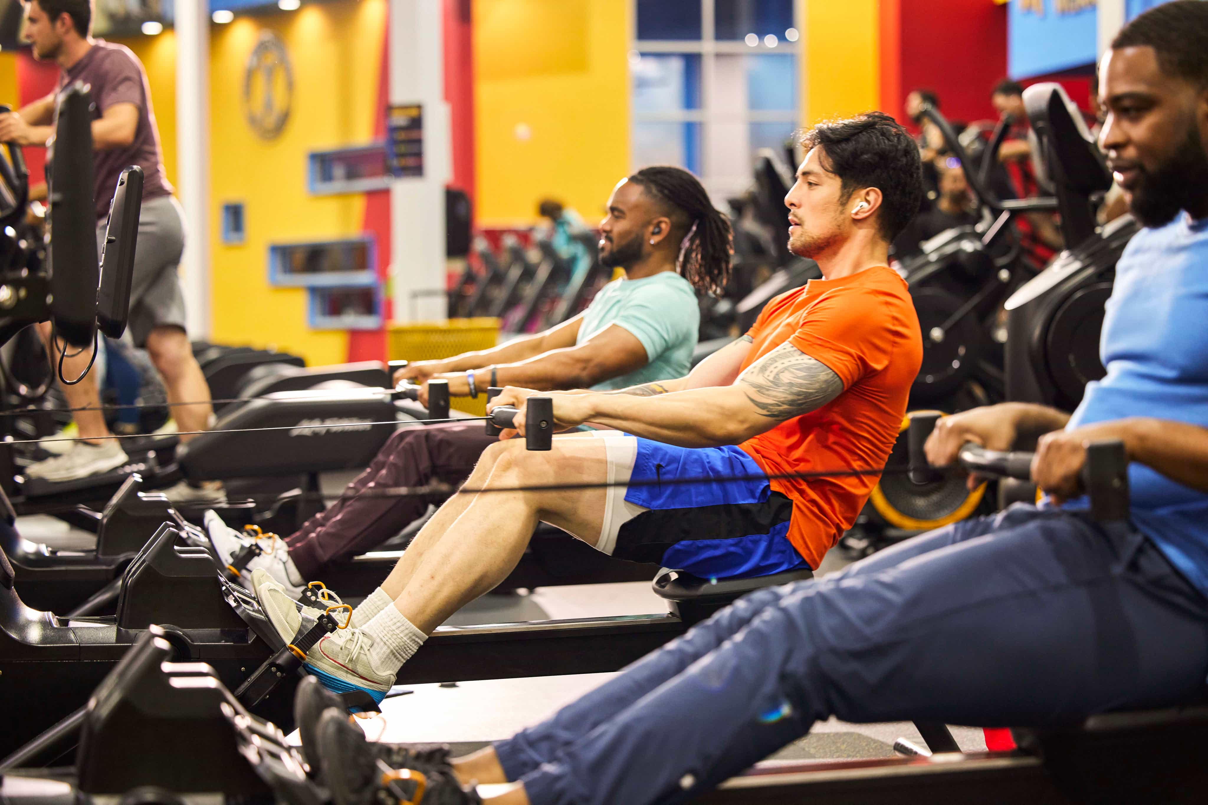 Men using the rowing machines at the gym